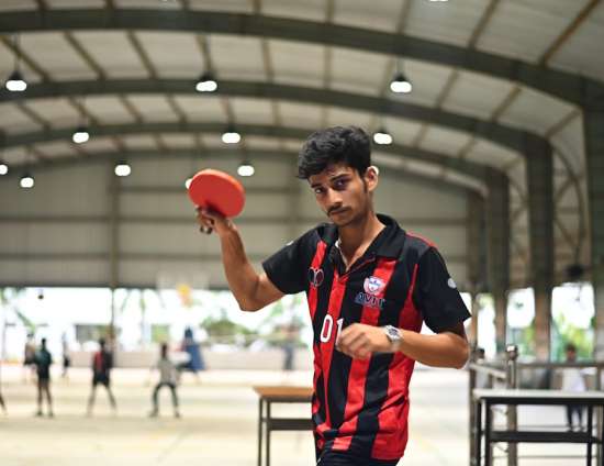 Student playing table tennis at VSEP's Sports Facility